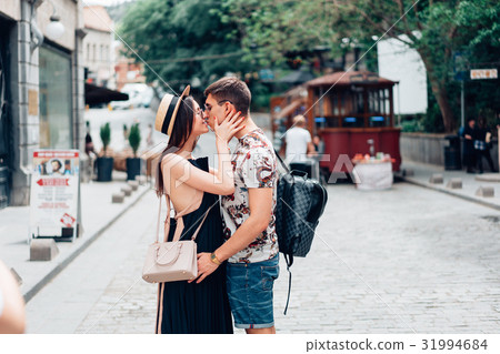 Young couple in love, hugging on the street. 31994684