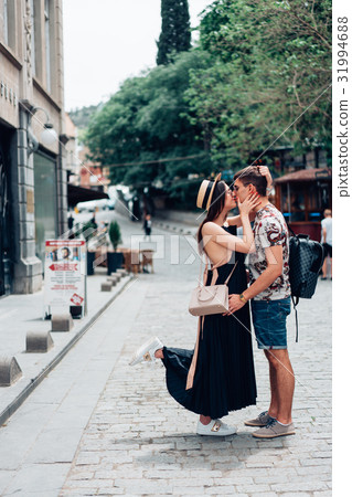 Young couple in love, hugging on the street. Young couple in love, hugging on the street. 31994688