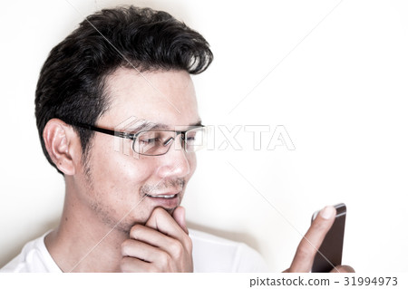 Man using smartphone with smile and happy Man using smartphone with smile and happy 31994973
