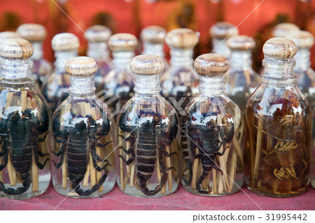 Bottle of Cobra and Scorpion Liquor 31995442