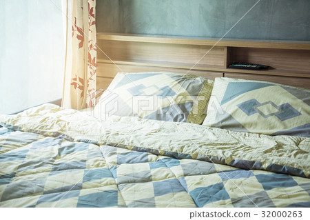 pillow and blanket on bed in vintage bedroom pillow and blanket on bed in vintage bedroom 32000263