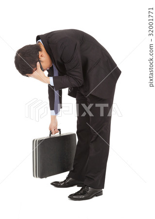 afflictive businessman stoop and hold his head 32001771