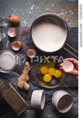 Cooking Catalan cream  on the stone backgroun Cooking Catalan cream  on the stone backgroun 32002605