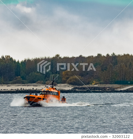 Orange pilot ship moving at speed Orange pilot ship moving at speed 32003122