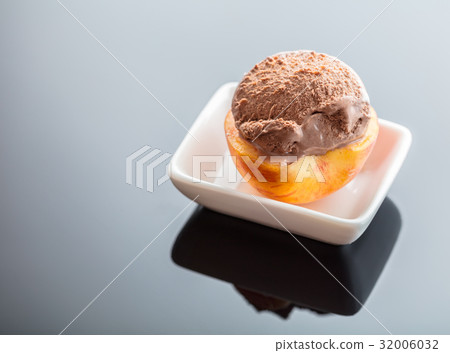 Dessert ice cream on peach Dessert ice cream on peach 32006032