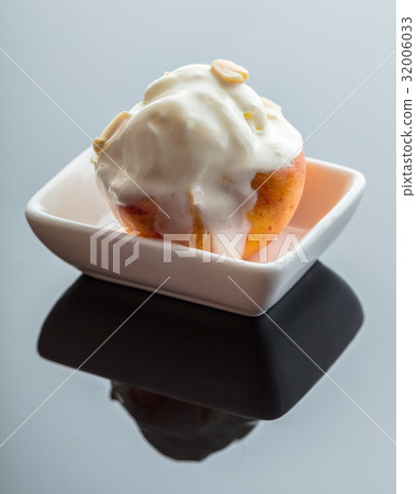 Dessert ice cream on peach Dessert ice cream on peach 32006033