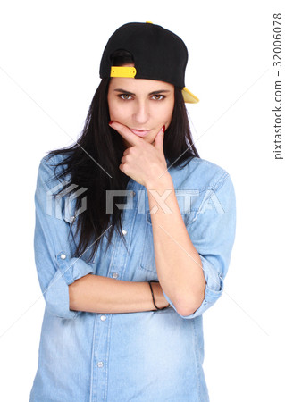 Portrait of young woman in cap posing on white Portrait of young woman in cap posing on white 32006078