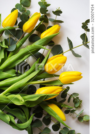 beautiful yellow tulips with eucalyptus branches beautiful yellow tulips with eucalyptus branches 32007454