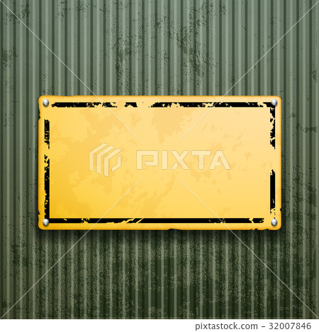 Yellow metal plate on grunge old surface. 32007846