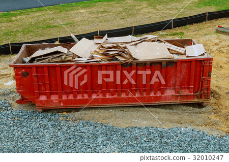 Dumpsters being full with garbage Dumpsters being full with garbage 32010247