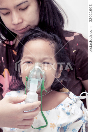 little girl crying while getting in inhaler mask little girl crying while getting in inhaler mask 32011668