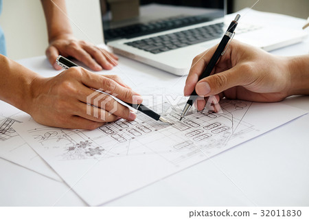 Hands of Engineer working on blueprint Hands of Engineer working on blueprint 32011830