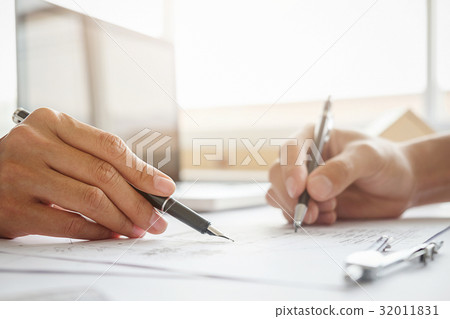 Hands of Engineer working on blueprint Hands of Engineer working on blueprint 32011831