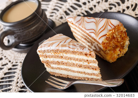 Two pieces of Esterhazy cake on a plate and coffee 32014683