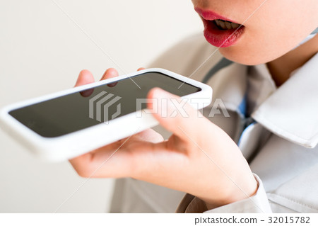 A female worker talking to a smartphone 32015782