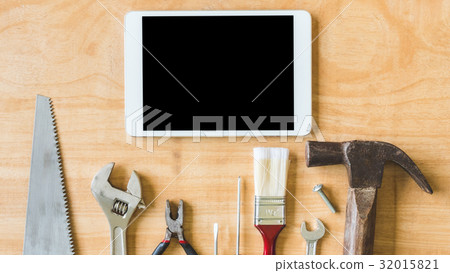 Set of different work tools with tablet on table Set of different work tools with tablet on table 32015821