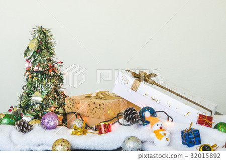 Gift boxes with Christmas decoration on the table. 32015892