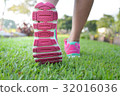 Woman walking on lawn 32016036