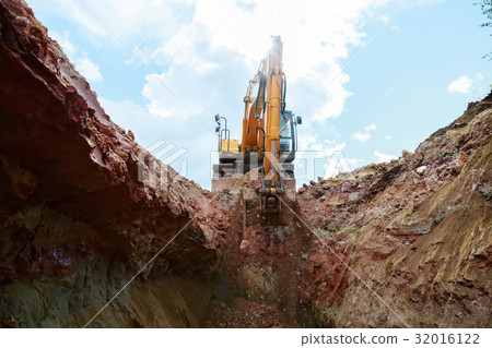 Excavator digging a pit. Excavator digging a pit. 32016122