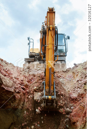 Excavator digging a pit. Excavator digging a pit. 32016127