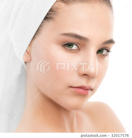 Beautiful young brunette woman with clean face and 32017576