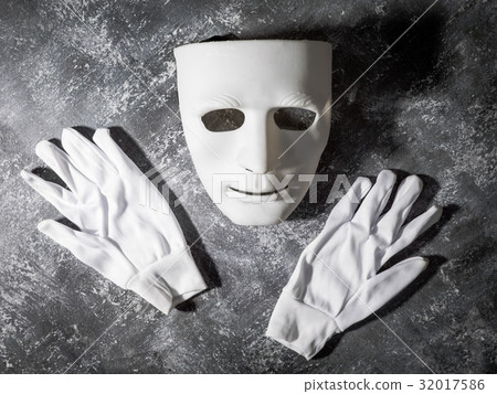 White mask with glove on gray grunge background. White mask with glove on gray grunge background. 32017586