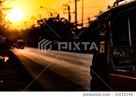 Thailand's tuk-tuk shining in the setting sun Thailand's tuk-tuk shining in the setting sun 32018349