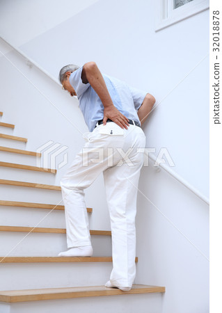 Senior man with low back pain 32018878