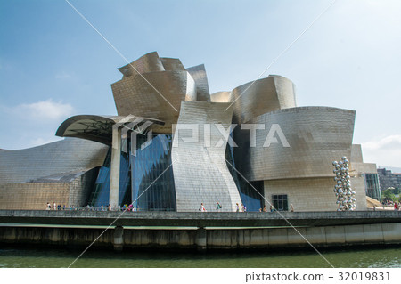 Spanish Guggenheim Museum stands along the Bilbao River Spanish Guggenheim Museum stands along the Bilbao River 32019831