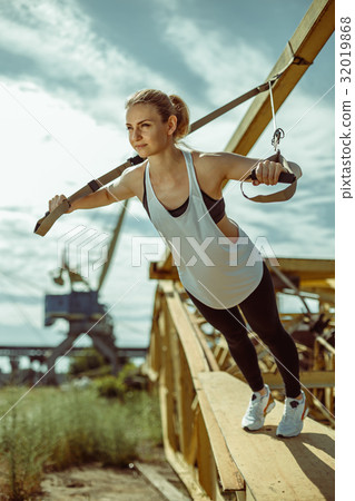 woman doing upper body exercise training arms 32019868