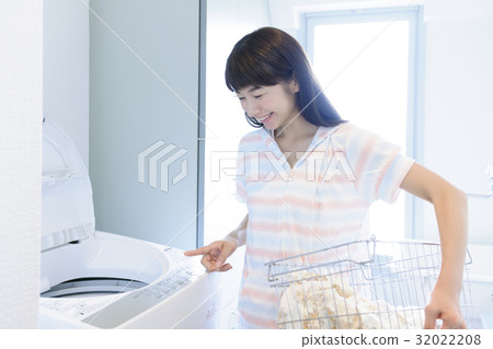 Woman doing laundry Lifestyle 32022208