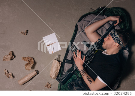 Soldier is sleeping with a rifle. Bad habits. Soldier is sleeping with a rifle. Bad habits. 32024295