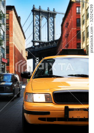 Taxi, retro car yellow color on the road 32024299