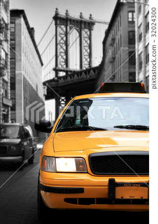 Taxi, retro car yellow color on the road 32024300