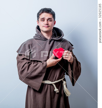 Portrait of Young catholic monk with heart shape Portrait of Young catholic monk with heart shape 32025185