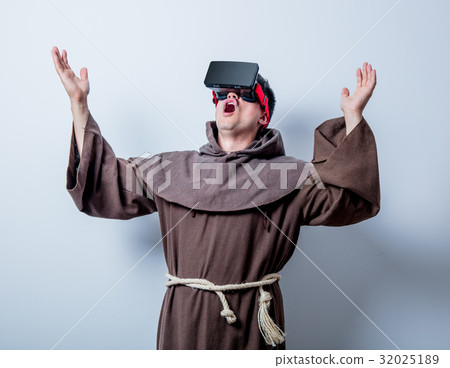 Portrait of Young catholic monk with 3D glasses Portrait of Young catholic monk with 3D glasses 32025189