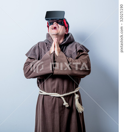 Portrait of Young catholic monk with 3D glasses Portrait of Young catholic monk with 3D glasses 32025190