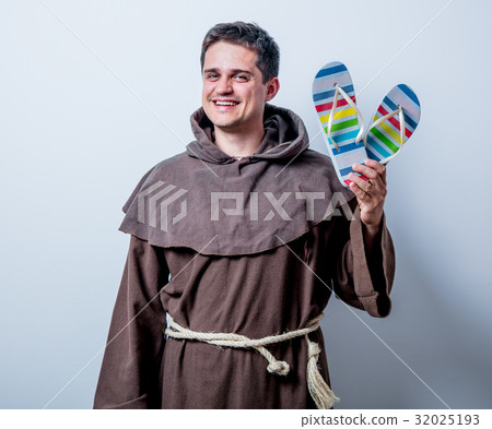 Young catholic monk with vacation flip flops 32025193
