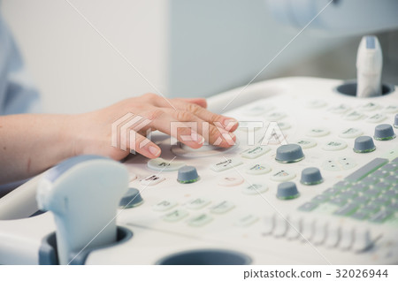 Hands on an ultrasound machine at modern clinic Hands on an ultrasound machine at modern clinic 32026944