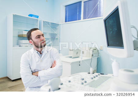 Portrait of a thinking doctor near sceen of 32026954