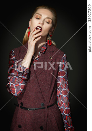 fashion model touching her lips with fingers fashion model touching her lips with fingers 32027209
