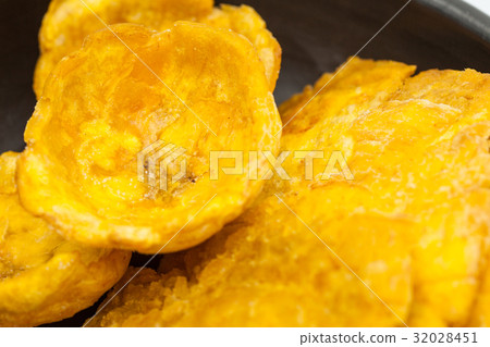 Plantain cups and patacones on black ceramic dish 32028451