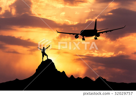 Airplane and silhouette of a standing happy man 32029757