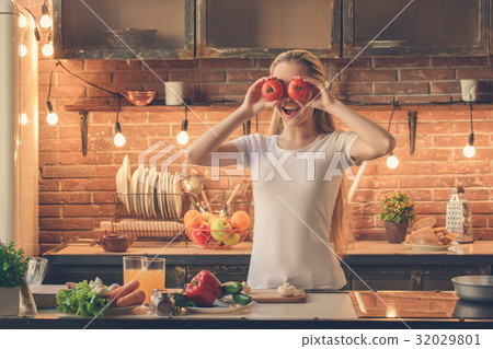 Young woman cooking healthy fresh meal at home Young woman cooking healthy fresh meal at home 32029801