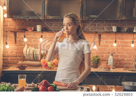 Young woman cooking healthy fresh meal at home Young woman cooking healthy fresh meal at home 32029803