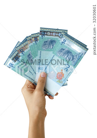Hand holding ringgit Malaysia currency 32030601