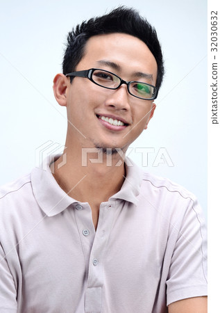 Young Asian male smiling. Young Asian male smiling. 32030632