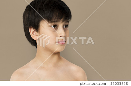 Young Boy with Serene Face Expression Studio Portrait 32035838