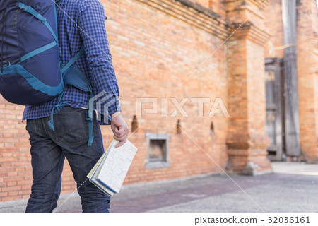 man traveler with backpacker holding location map man traveler with backpacker holding location map 32036161