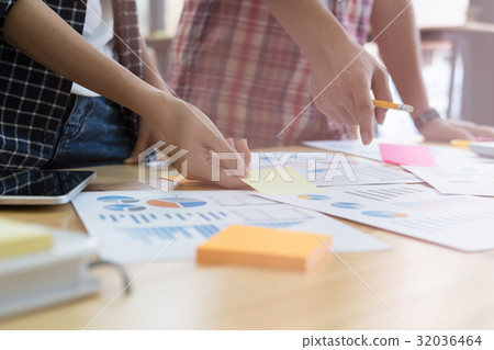 startup young successful team on meeting in modern office interior brainstorming, make a business plan, working on tablet with financial and marketing graph and chart startup young successful team on meeting in modern office interior brainstorming, make a business plan, working on tablet with financial and marketing graph and chart 32036464